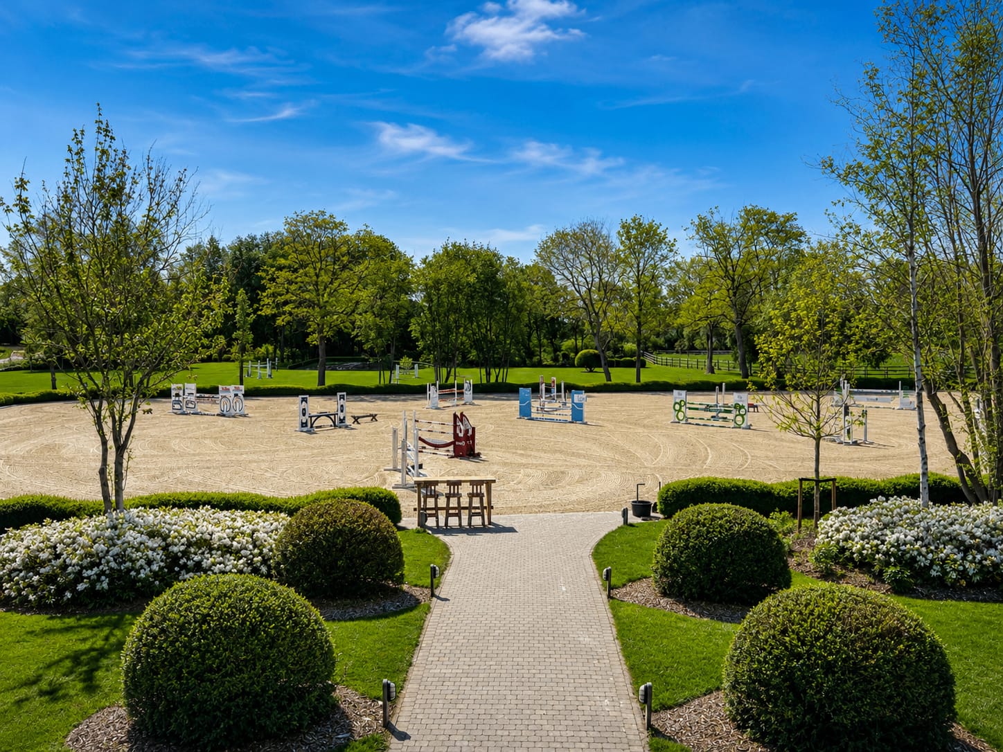 Outdoor riding arena at Eyckenhoeve with show jumps